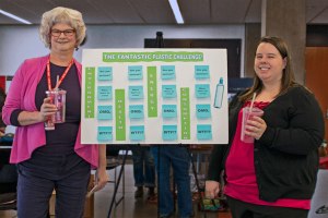 Lea and Marjorie pose with the Eco-Quiz board. 